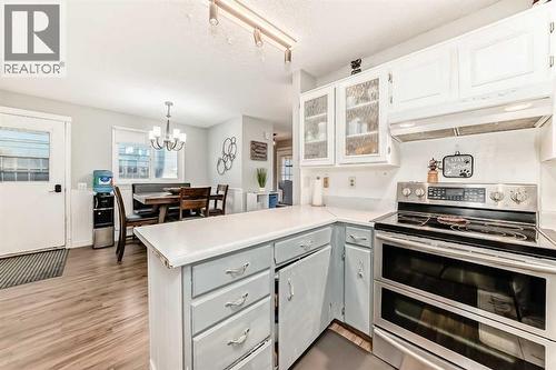 Your kitchen and dining area is the perfect place to visit, while preparing meals for friends and family - 7840 20A Street Se, Calgary, AB - Indoor Photo Showing Kitchen