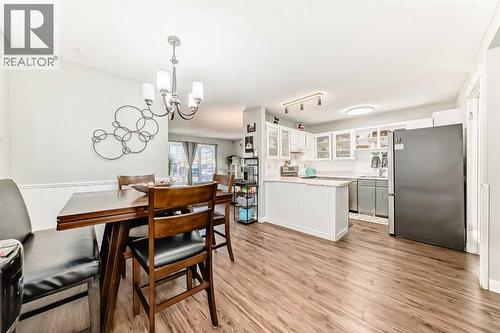 Dining and kitchen area, located just off the large livingroom - 7840 20A Street Se, Calgary, AB - Indoor Photo Showing Dining Room