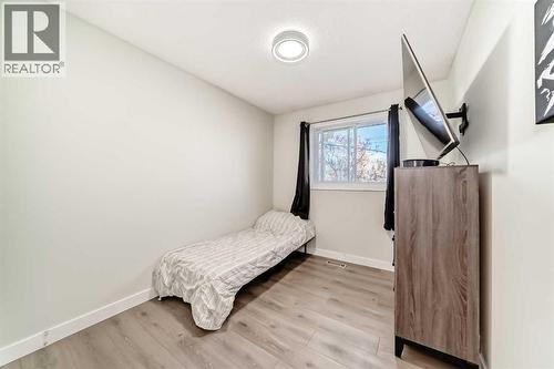 Secondary bedroom, with brand new windows - 7840 20A Street Se, Calgary, AB - Indoor Photo Showing Bedroom