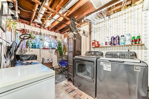 New washer and dryer, complete with transferable warranty - 7840 20A Street Se, Calgary, AB - Indoor Photo Showing Laundry Room