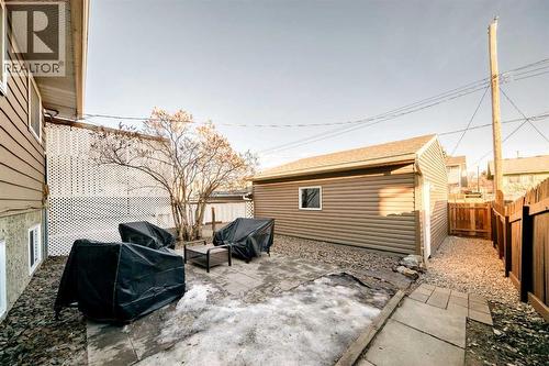 Your BRAND NEW garage not only provides you with the ultimate place to park your vehicles. but adds to the privacy in this perfect yard - 7840 20A Street Se, Calgary, AB - Outdoor With Exterior