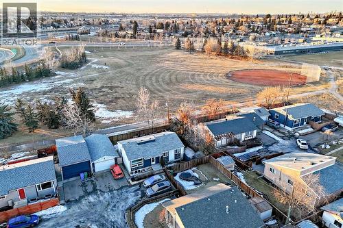 A baseball diamond a block away from your new home! - 7840 20A Street Se, Calgary, AB - Outdoor With View