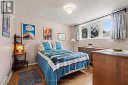 Second bedroom with wall of windows. - 