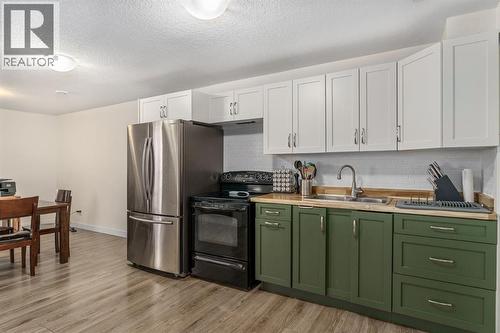 17 Aster Place Se, Airdrie, AB - Indoor Photo Showing Kitchen With Double Sink