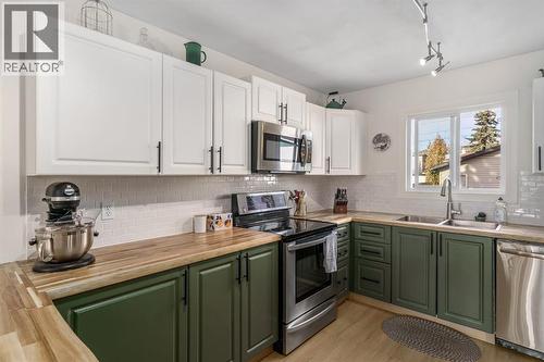 17 Aster Place Se, Airdrie, AB - Indoor Photo Showing Kitchen With Double Sink