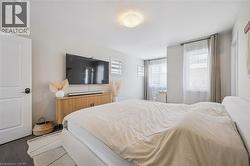 Bedroom featuring wood finished floors - 