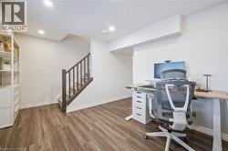 Office space with wood finished floors and recessed lighting - 