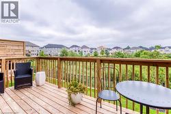 Wooden terrace featuring a residential view - 