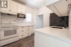 Recently updated kitchen, with subway tile backsplash and quartz countertops. - 