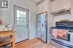Unit #2's kitchen features stainless steel appliances. - 