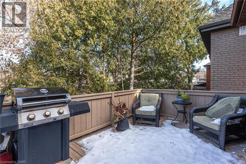 Unit #2's private back deck overlooks the mature trees in the large backyard. - 388 Charlton Avenue W, Hamilton, ON - Outdoor With Deck Patio Veranda
