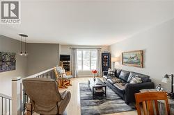 Living room featuring wood finished floors - 