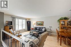Living area featuring light wood-style floors and baseboards - 