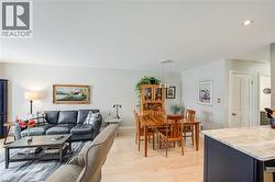 Dining space featuring light wood-type flooring and baseboards - 