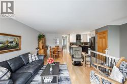 Living area featuring light wood-type flooring and recessed lighting - 