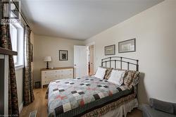 Bedroom featuring light wood-style flooring and baseboards - 