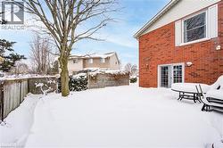 View of yard covered in snow - 