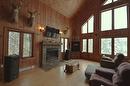 Salon - 169 Ch. Roy, Amherst, QC  - Indoor Photo Showing Living Room With Fireplace 