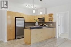 Well lit kitchen with ample storage - 