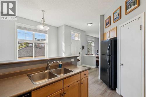 77 Mckenzie Towne Gate Se, Calgary, AB - Indoor Photo Showing Kitchen With Double Sink