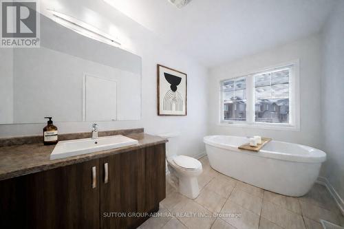 This photo has been virtually staged. - 217 Bennett Street, Newmarket, ON - Indoor Photo Showing Bathroom