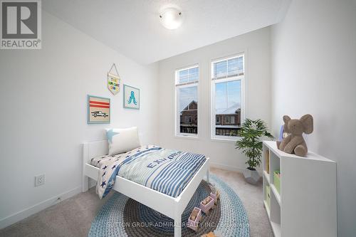 This photo has been virtually staged. - 217 Bennett Street, Newmarket, ON - Indoor Photo Showing Bedroom