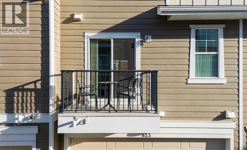 Rear Deck Above Double Garage - 623 Cranbrook Walk Se, Calgary, AB - Outdoor With Exterior