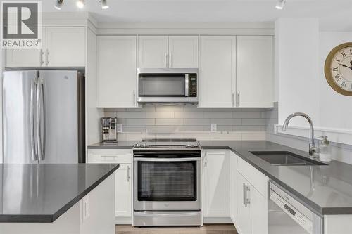 Kitchen - 623 Cranbrook Walk Se, Calgary, AB - Indoor Photo Showing Kitchen With Stainless Steel Kitchen With Upgraded Kitchen
