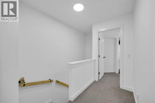 Upstairs Hallway - 623 Cranbrook Walk Se, Calgary, AB - Indoor Photo Showing Other Room