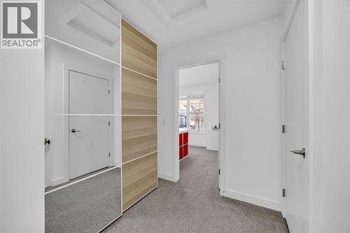 Upstairs Storage Units - 623 Cranbrook Walk Se, Calgary, AB - Indoor Photo Showing Other Room
