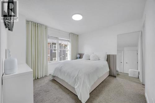 Primary Bedroom #1 - 623 Cranbrook Walk Se, Calgary, AB - Indoor Photo Showing Bedroom