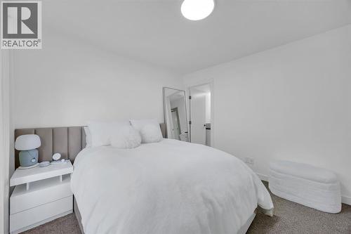 Primary Bedroom #1 - 623 Cranbrook Walk Se, Calgary, AB - Indoor Photo Showing Bedroom
