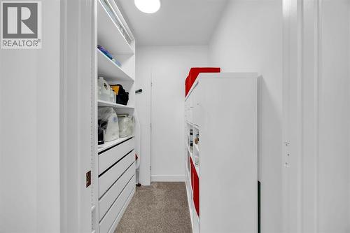 Walk In Closet in Primary Bedroom #2 - 623 Cranbrook Walk Se, Calgary, AB - Indoor Photo Showing Other Room