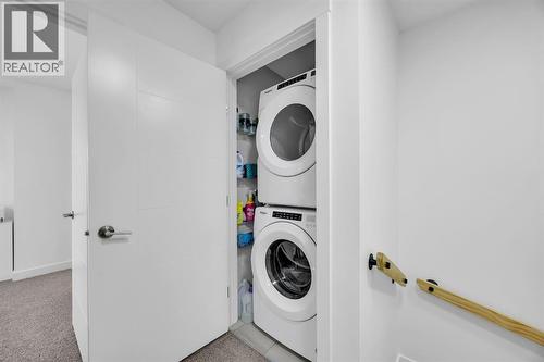Upstairs Laundry - 623 Cranbrook Walk Se, Calgary, AB - Indoor Photo Showing Laundry Room