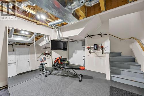 Lower Level Storage - 623 Cranbrook Walk Se, Calgary, AB - Indoor Photo Showing Gym Room