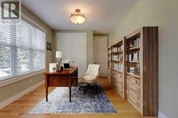 Main Floor Bedroom/Office/flex room, virtually staged - 