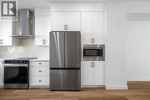 302, 550 Seton Circle Se, Calgary, AB - Indoor Photo Showing Kitchen With Stainless Steel Kitchen With Upgraded Kitchen