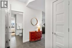 An elegant and refined ground-level corner residence in the esteemed Currie Barracks community - 