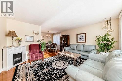 5232 44 Avenue Nw, Calgary, AB - Indoor Photo Showing Living Room With Fireplace