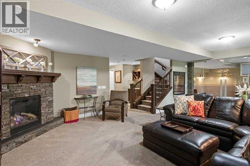 41 Evergreen Mount Sw, Calgary, AB - Indoor Photo Showing Living Room With Fireplace