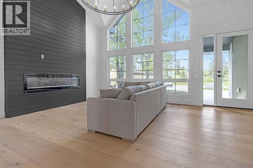 340 West Chestermere Drive, Chestermere, AB - Indoor Photo Showing Living Room With Fireplace