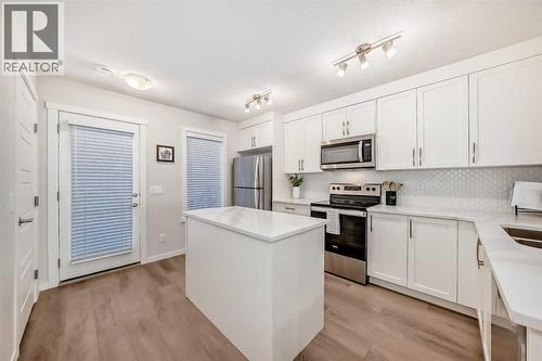 307, 474 Seton Circle Se, Calgary, AB - Indoor Photo Showing Kitchen With Stainless Steel Kitchen With Upgraded Kitchen