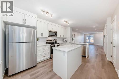 307, 474 Seton Circle Se, Calgary, AB - Indoor Photo Showing Kitchen With Stainless Steel Kitchen With Upgraded Kitchen