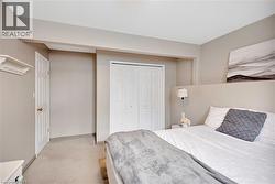 Bedroom with carpet floors and a closet - 