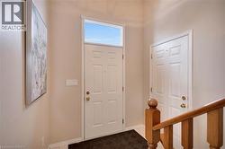 Entrance foyer featuring baseboards - 