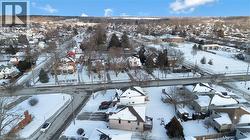 Snowy aerial view featuring a residential view - 