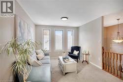 Carpeted living room with baseboards - 