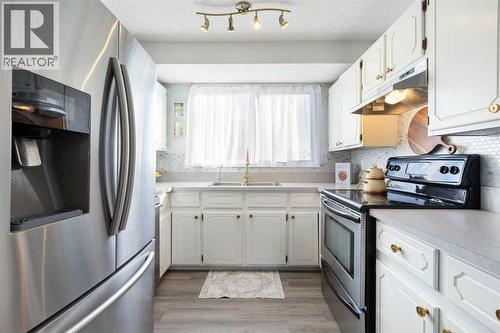 27 Deercrest Close Se, Calgary, AB - Indoor Photo Showing Kitchen With Stainless Steel Kitchen With Double Sink