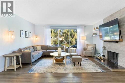 27 Deercrest Close Se, Calgary, AB - Indoor Photo Showing Living Room With Fireplace