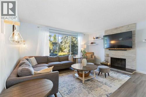27 Deercrest Close Se, Calgary, AB - Indoor Photo Showing Living Room With Fireplace